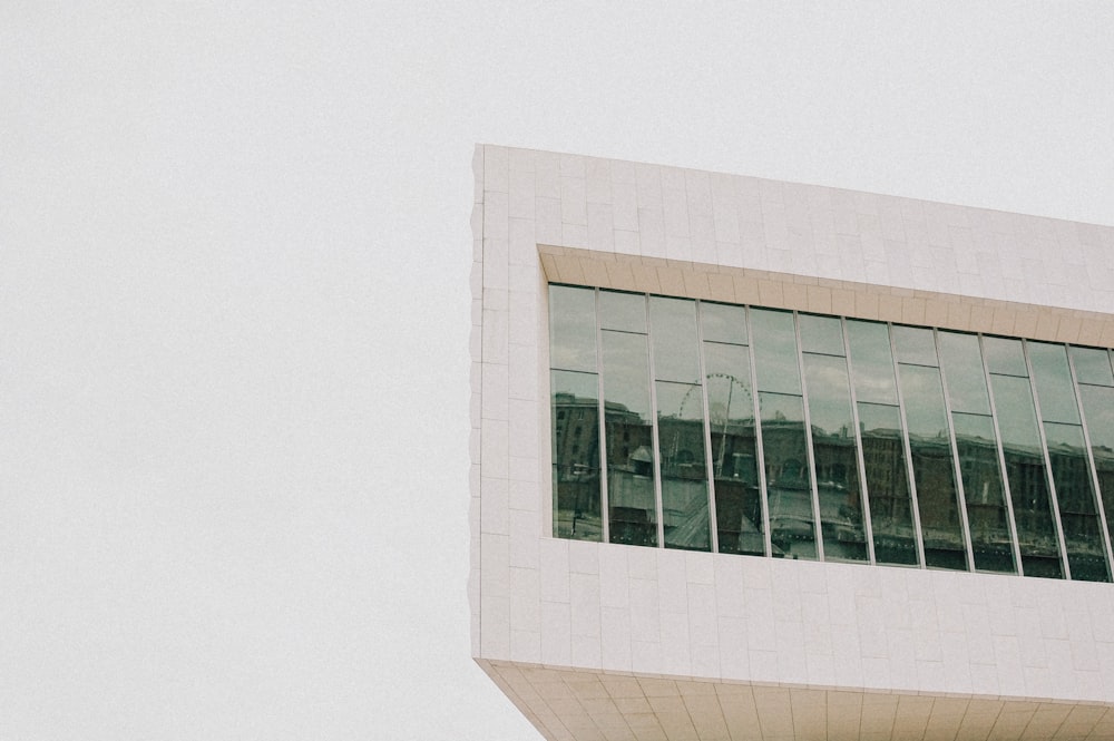 white concrete building with glass windows