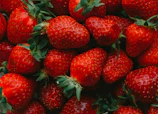 red strawberries on black surface