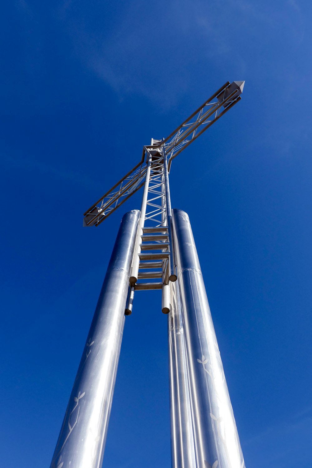 gray metal tower under blue sky during daytime