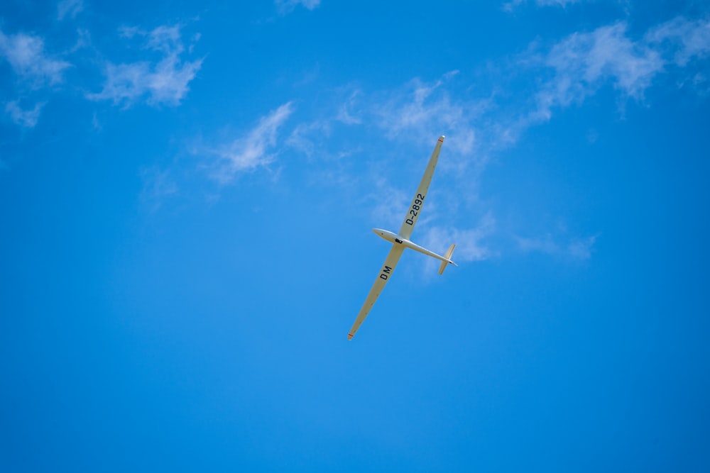 white and red plane in the sky