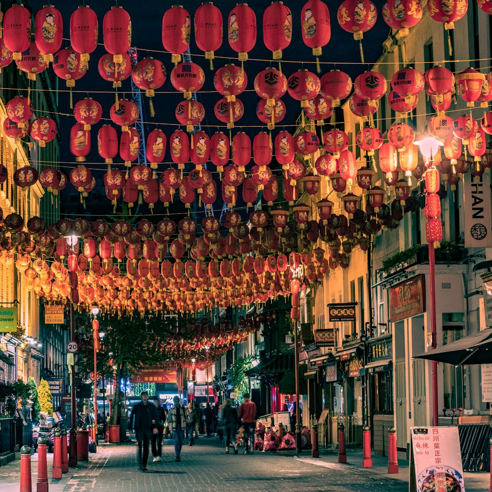 red paper lanterns on street during daytime
