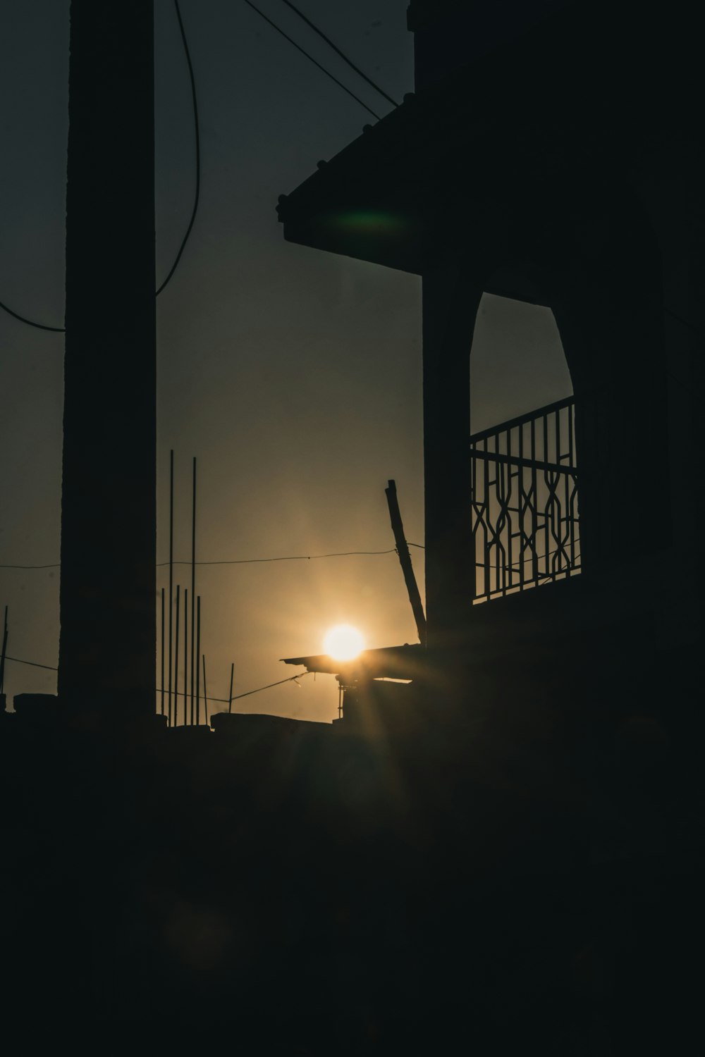 silhouette of a building during sunset