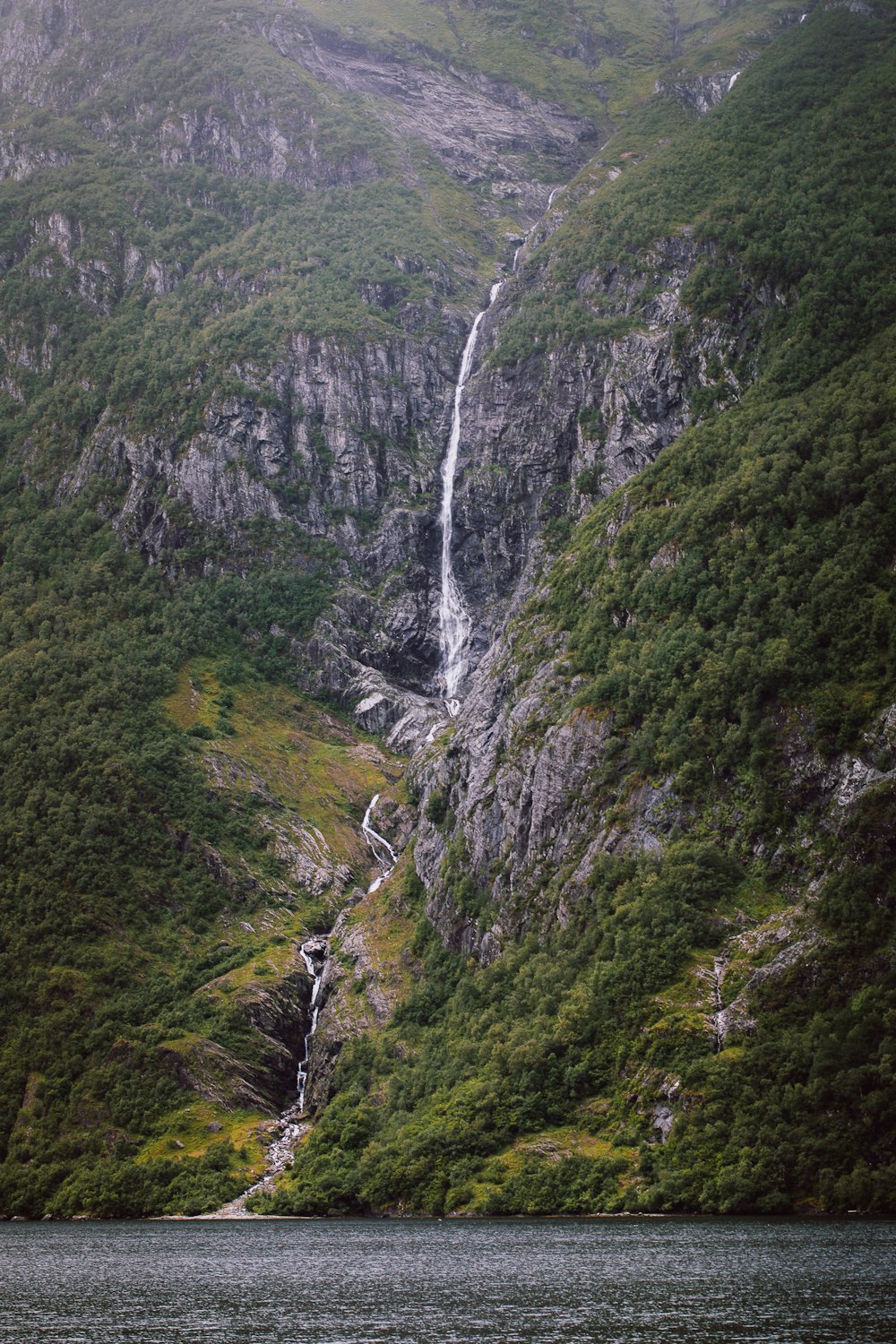 green and gray mountain with water falls