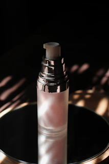 Close-up of a luxurious serum bottle with soft natural lighting highlighting its elegant design