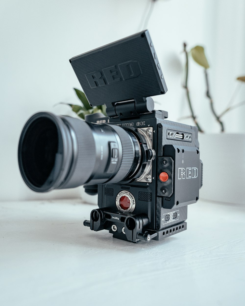 black and silver dslr camera on white table