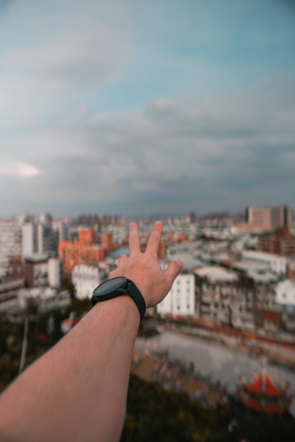 person wearing black watch with black strap