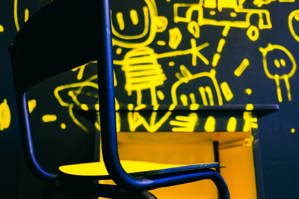 blue and yellow metal chair