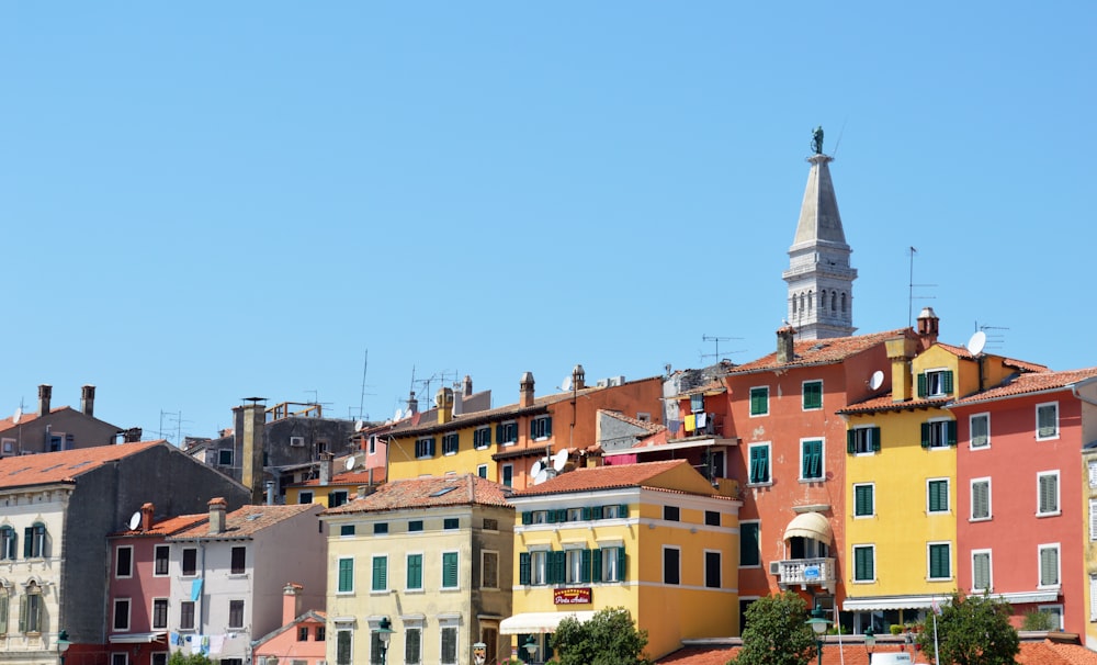 brown and white concrete buildings under blue sky during daytime