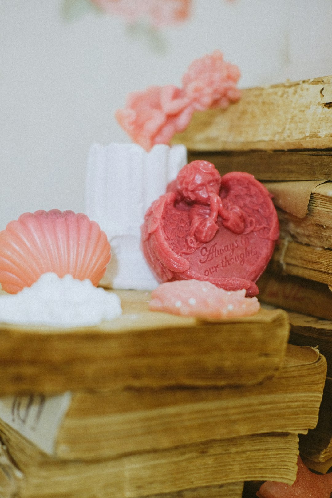 pink cupcake on brown wooden table