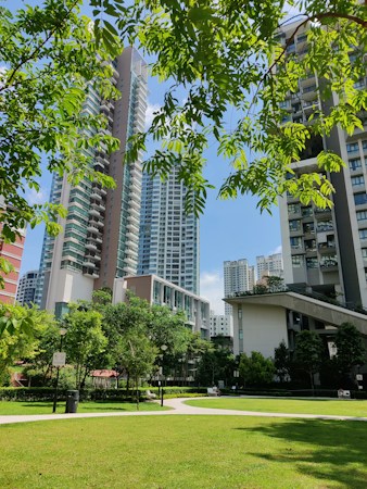 A white low-rise condo building with a green lawn, similar to many two-story attached housing communities in the Las Vegas valley