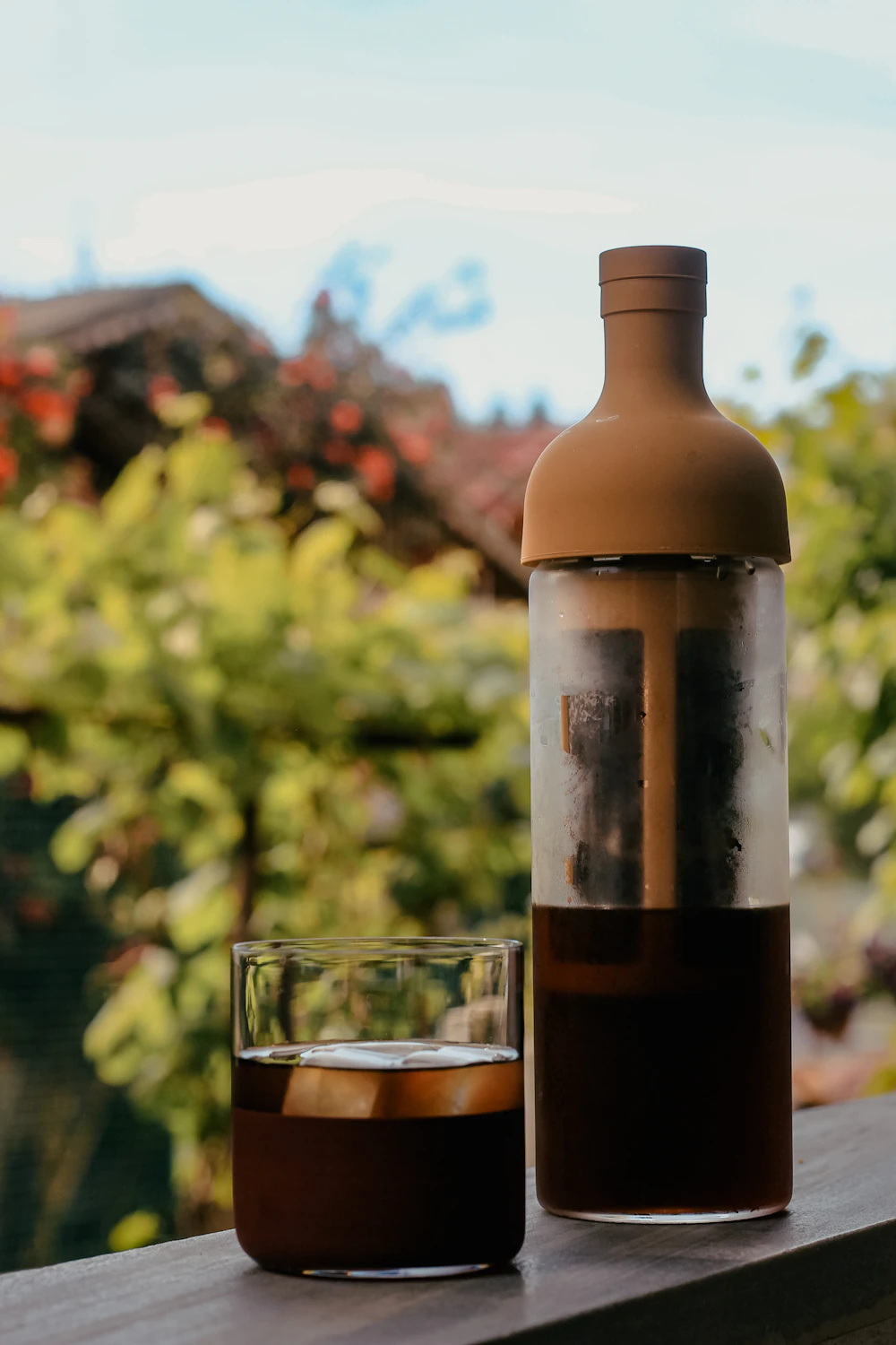 Glass bottle of cold brew with a wooden cap