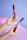 A close-up of hands holding eco-friendly makeup products.