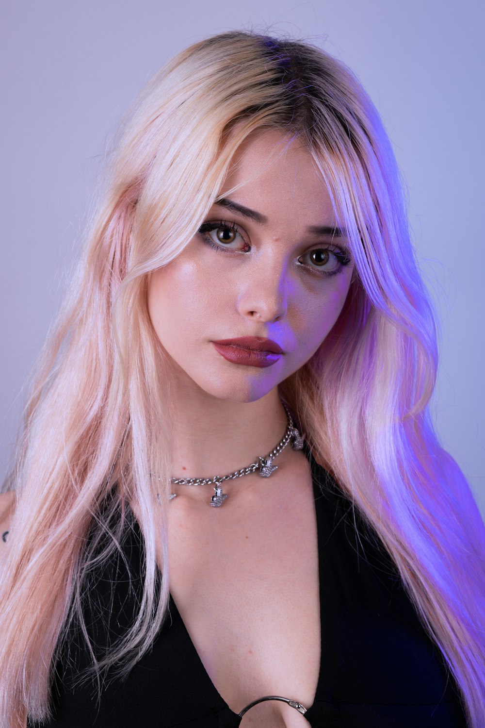 woman in black tank top wearing silver necklace