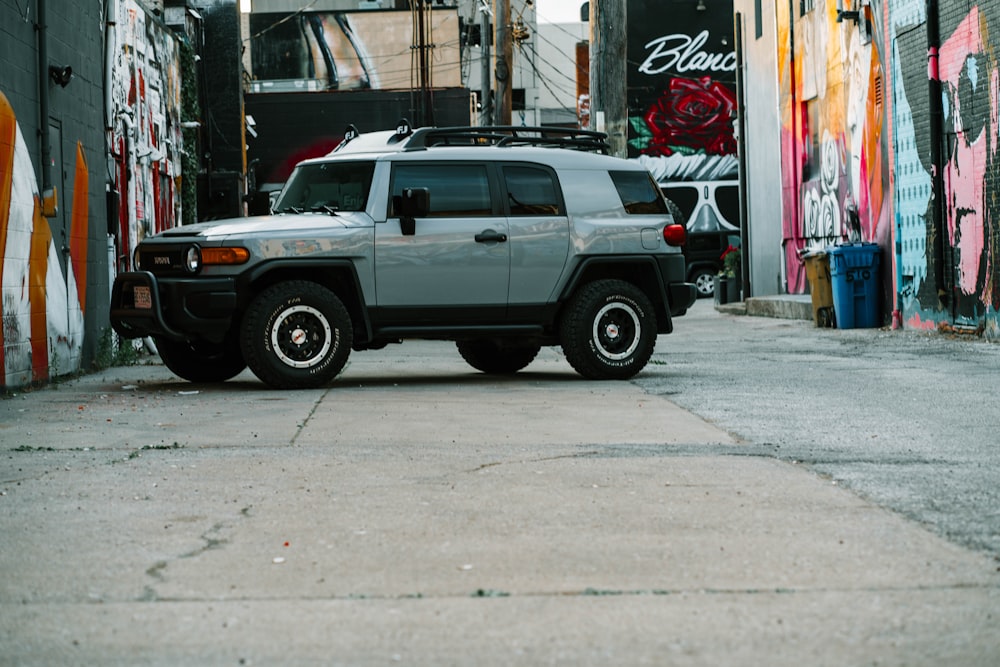 white crew cab pickup truck parked on sidewalk during daytime