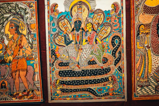 Illustration of a traditional Indian scroll depicting scenes from the Puranas.