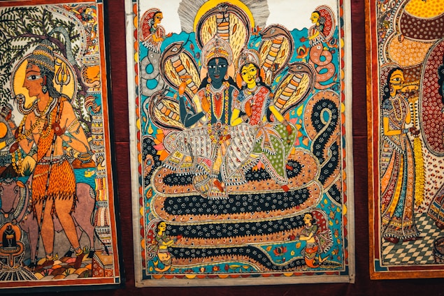An ancient scroll unfurled with illustrations depicting scenes from the Mahabharata.