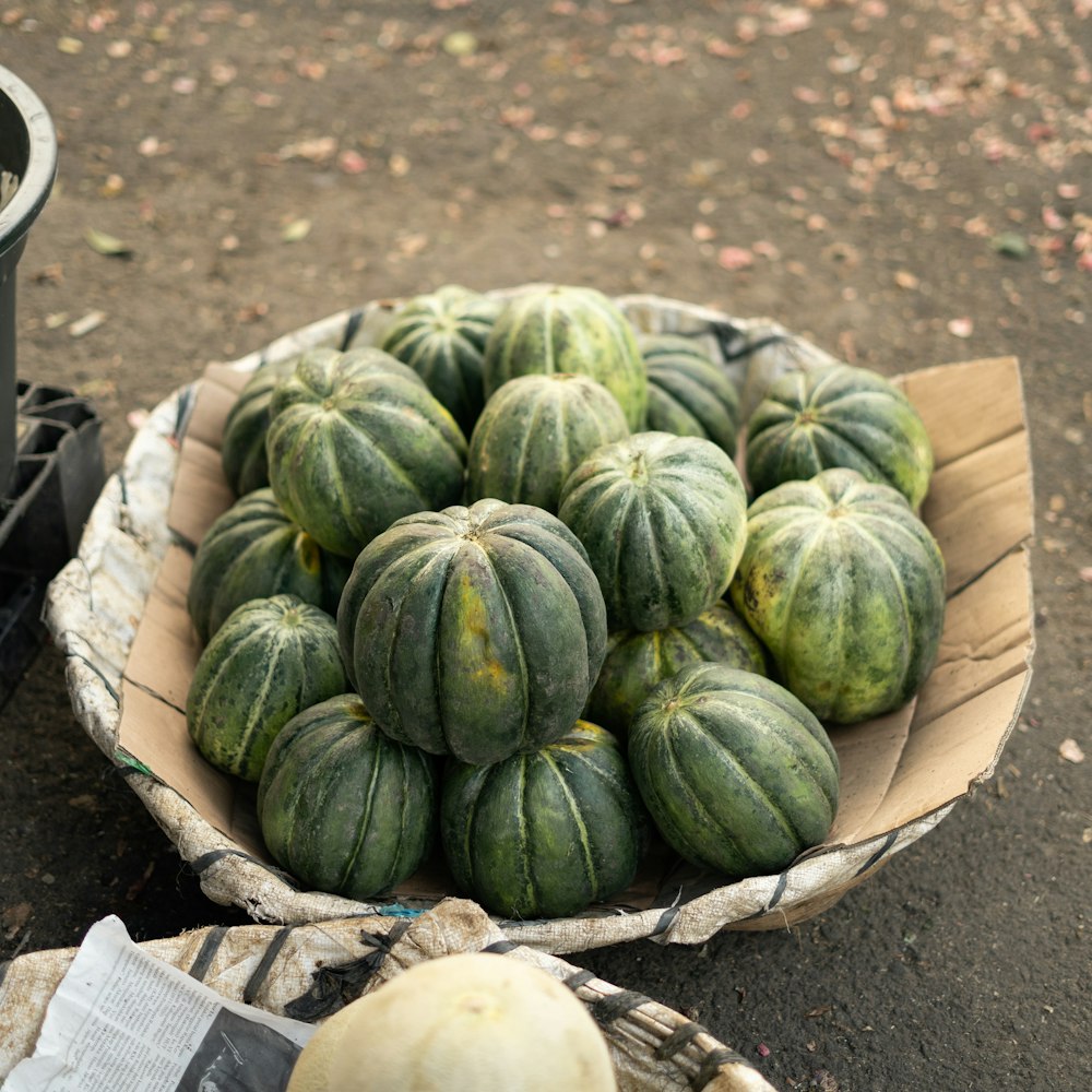 green and yellow squash on brown wooden crate