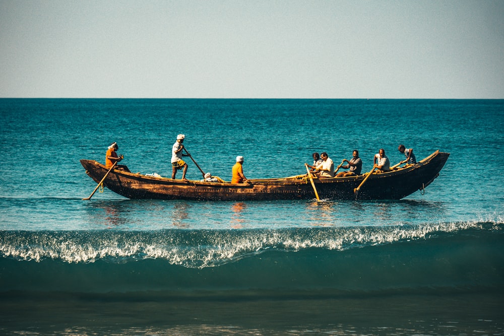 a group of people riding on the back of a boat