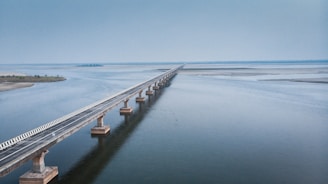 white wooden dock on sea under blue sky during daytime