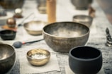 stainless steel bowl on white table cloth