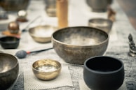 stainless steel bowl on white table cloth