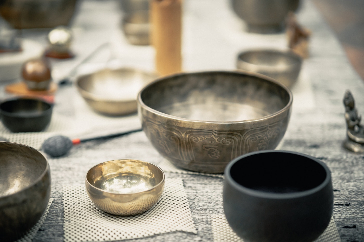 Singing bowls in soft candlelight