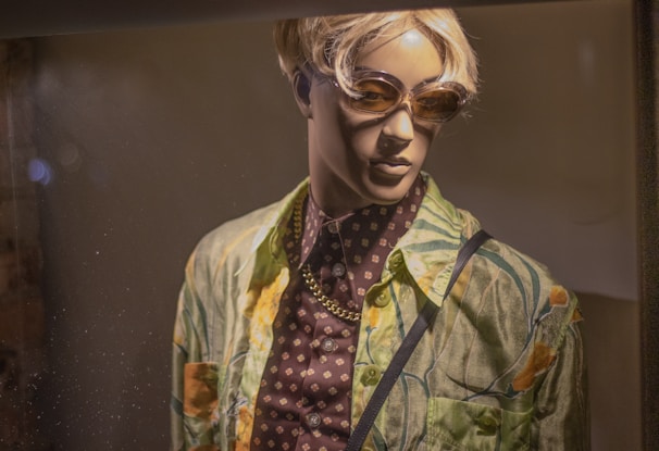 Brightly colored streetwear inspired by tropical and urban styles displayed on mannequins.