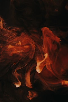 A fiery red and orange alcohol ink artwork.