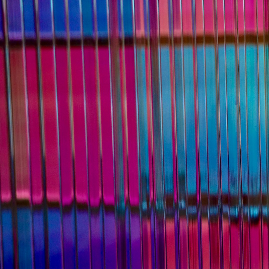 pink blue and green striped textile