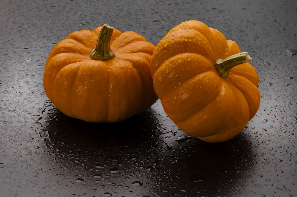 orange pumpkin on black table