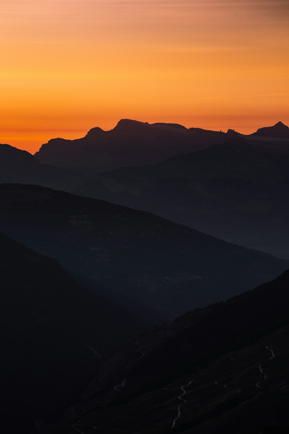 silhouette of mountains during sunset