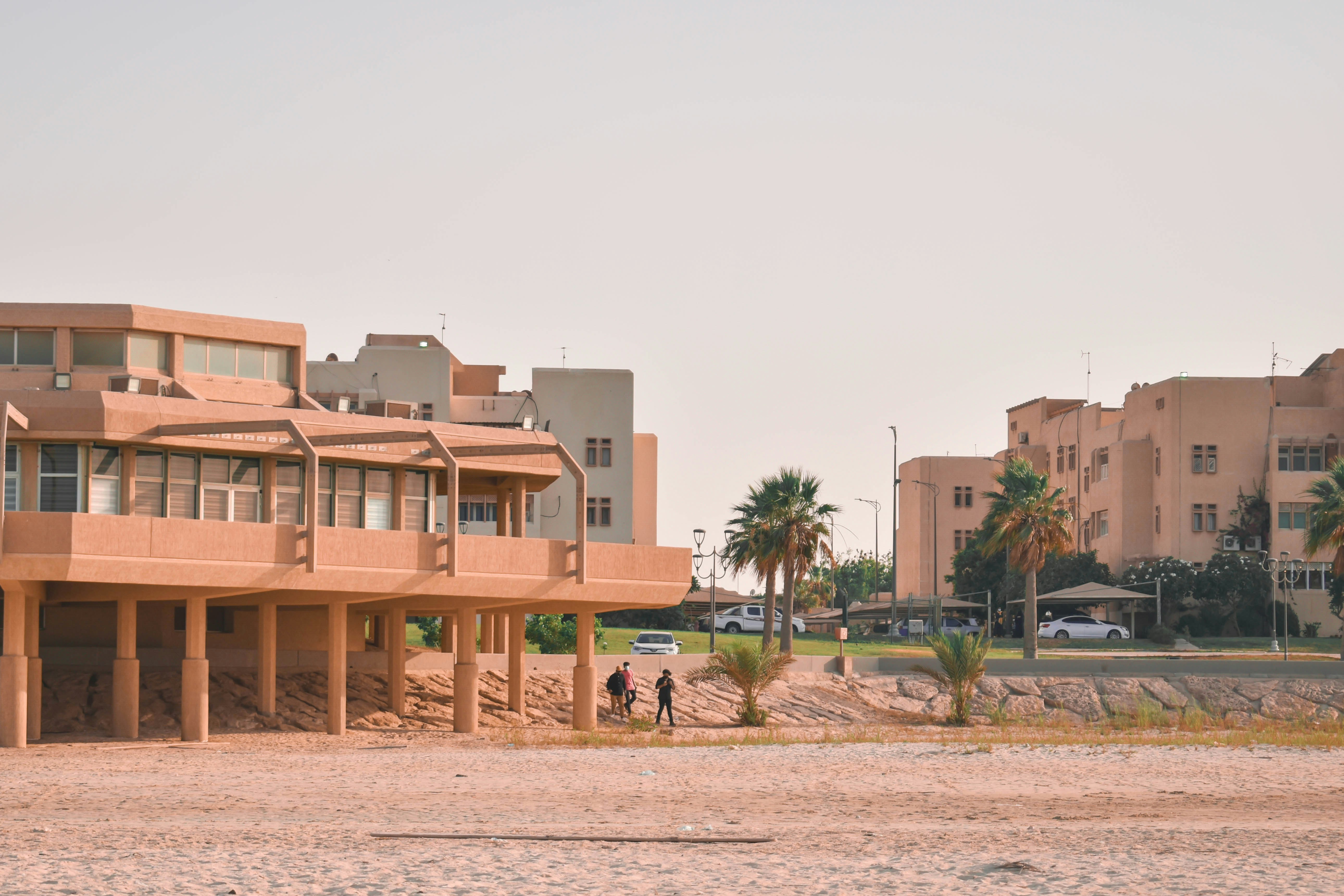 brown concrete building near green trees during daytime