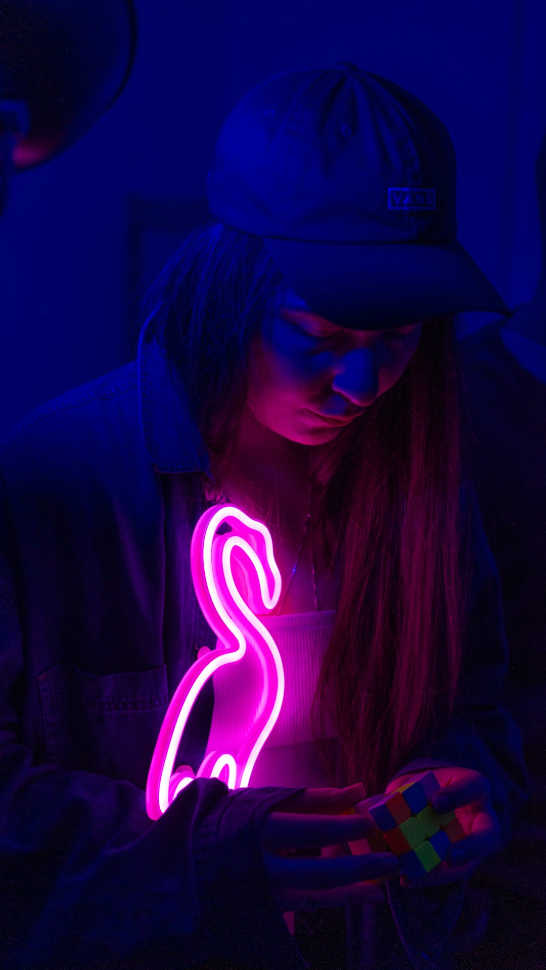 woman in black hoodie with blue light