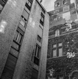 Before and after side-by-side of a weathered facade transformed into a vibrant, preserved exterior.