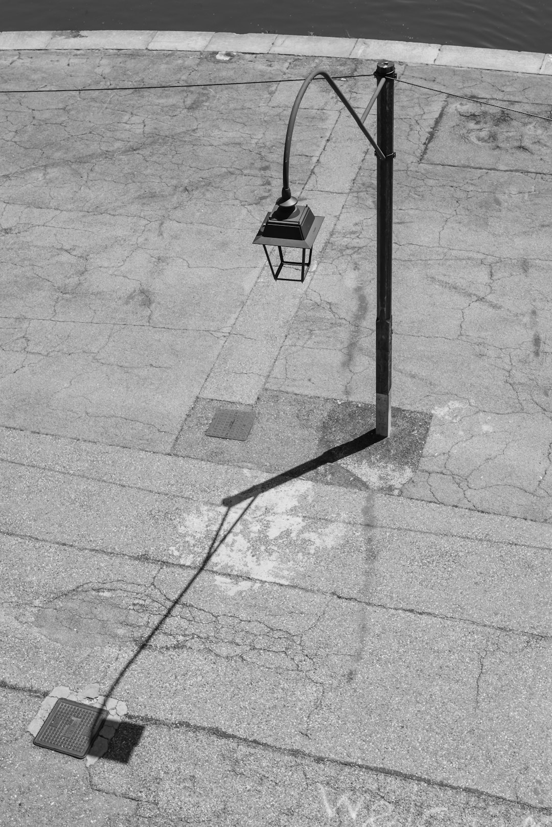 black basketball hoop on gray concrete floor