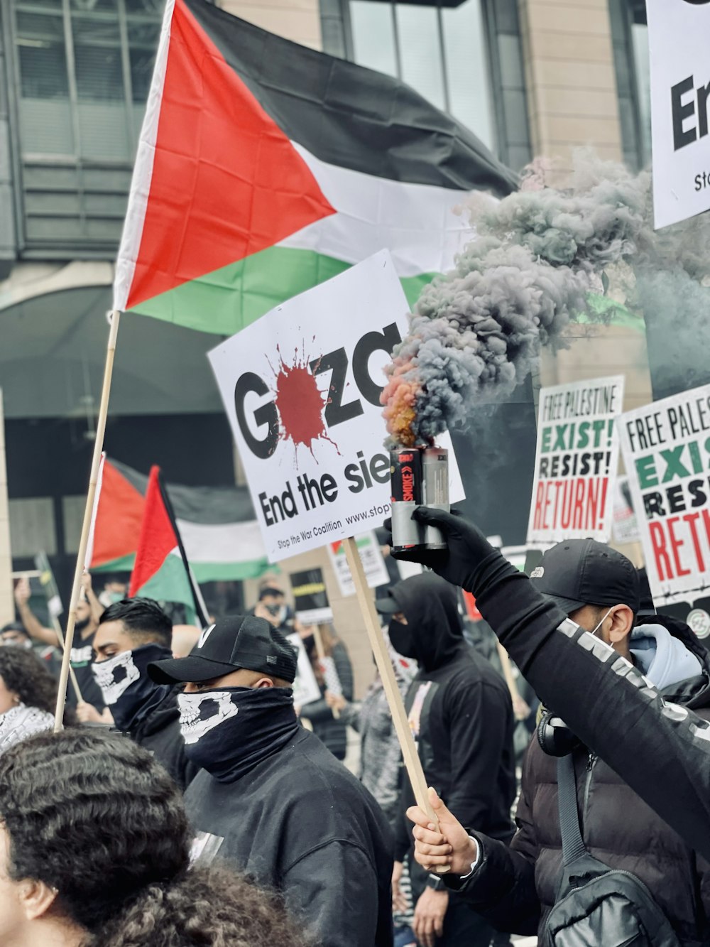 people holding flags during daytime