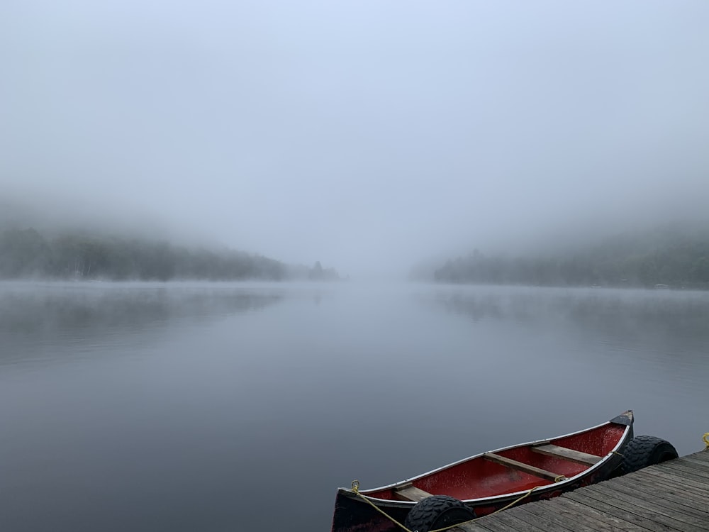 red boat on calm water