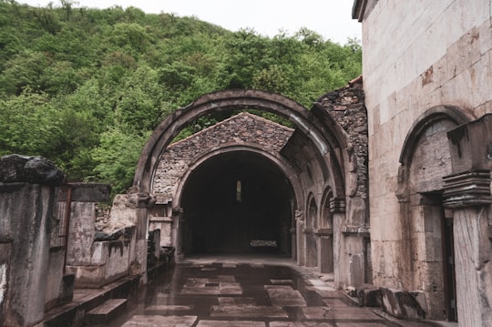 brown brick building near green trees during daytime in Vahanavank Monastery Armenia