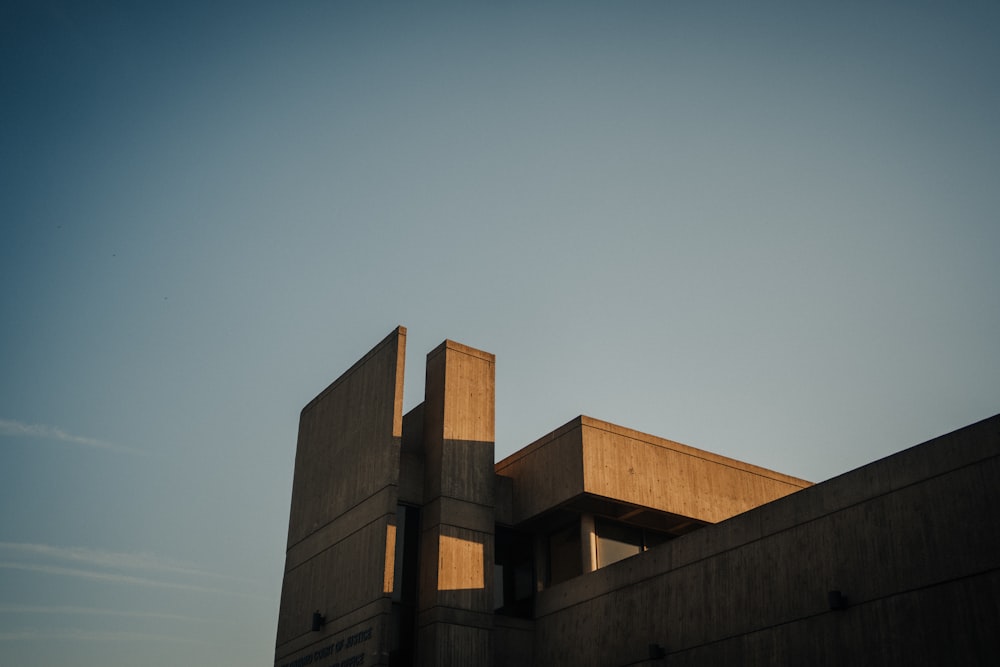 brown concrete building under blue sky during daytime