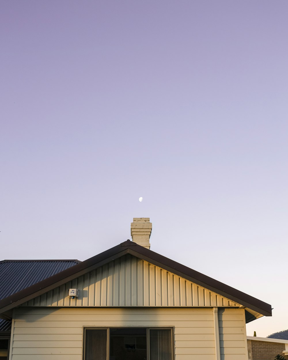 brown and white wooden house under blue sky during daytime