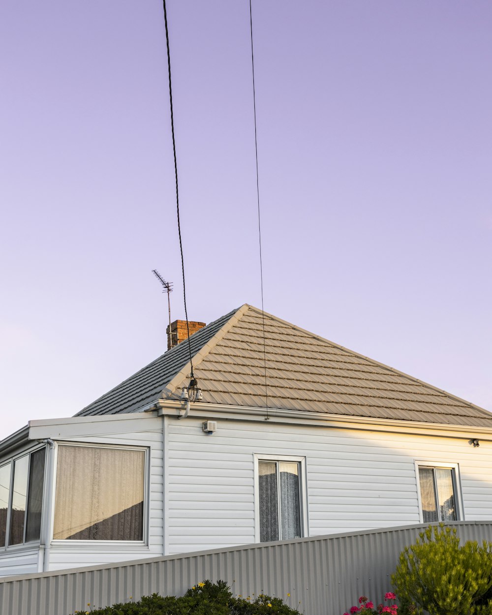 white and brown wooden house under blue sky during daytime