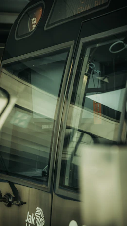 Close-up of a finely crafted vinyl wrap on a tram, blending artistic design with commercial messaging.