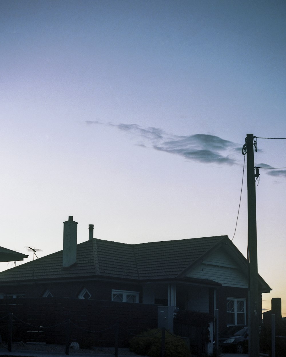 white and black house under blue sky during daytime