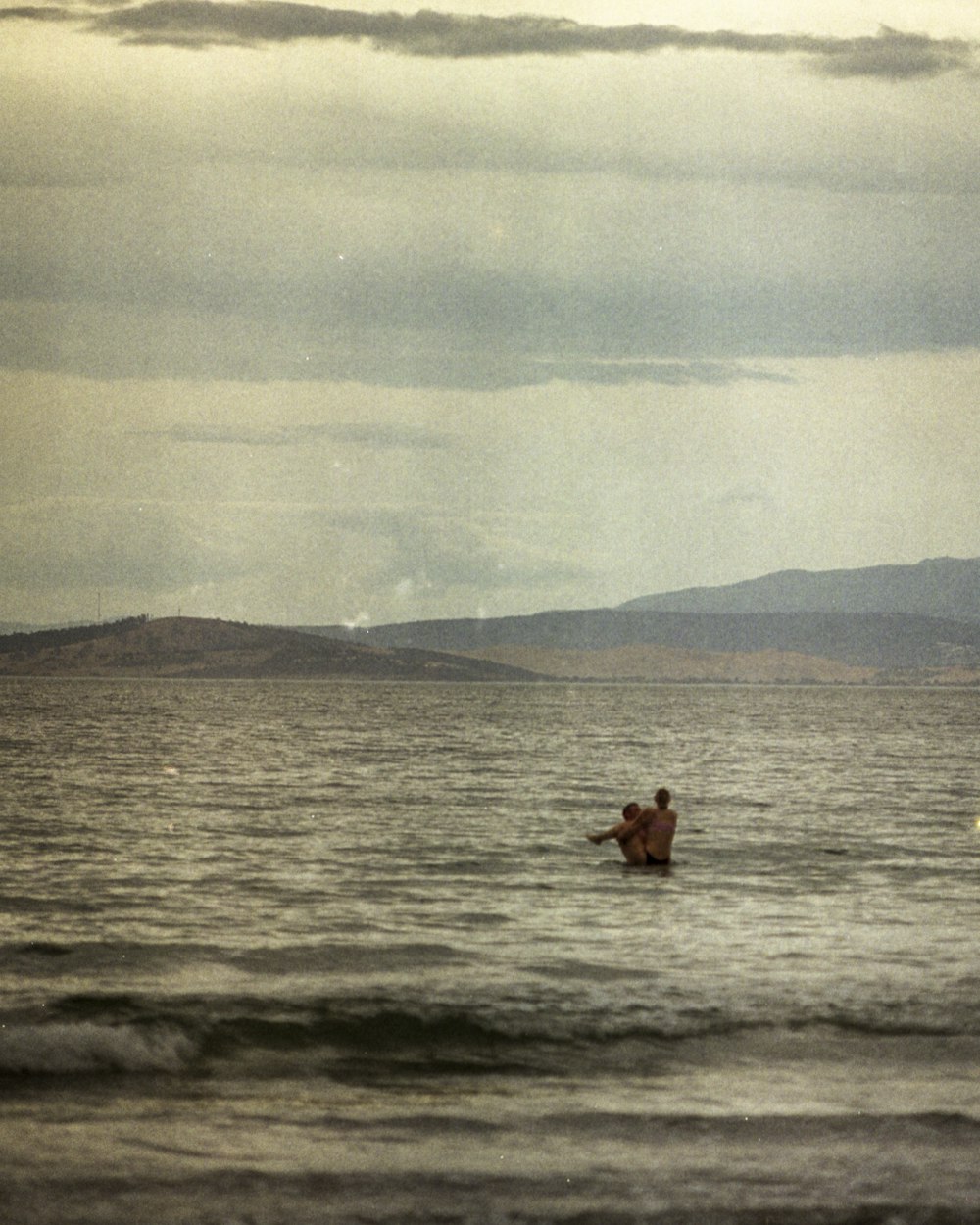 2 people on body of water during daytime