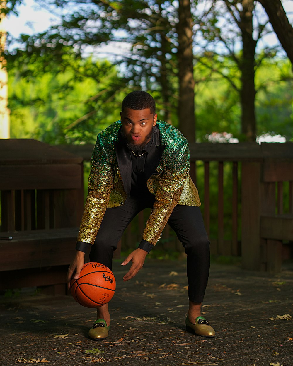 woman in green and black long sleeve shirt holding basketball