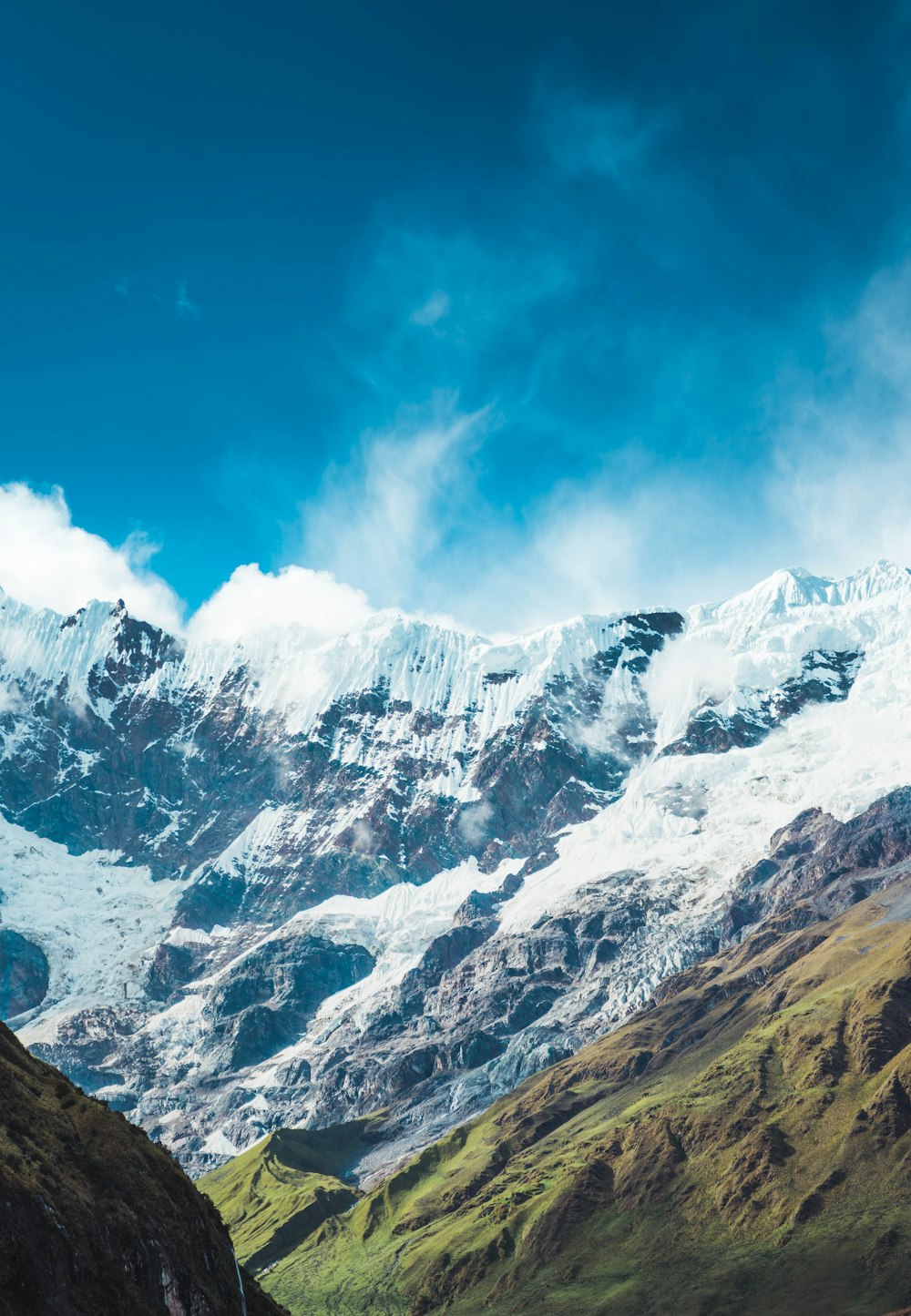 snow covered mountain under blue sky during daytime