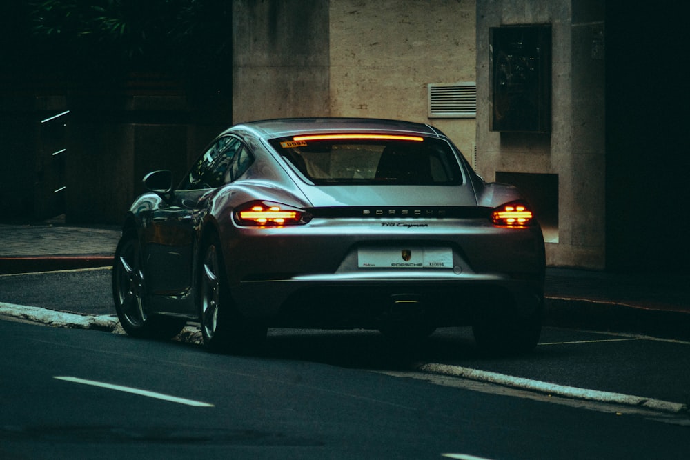 black sedan on road during daytime