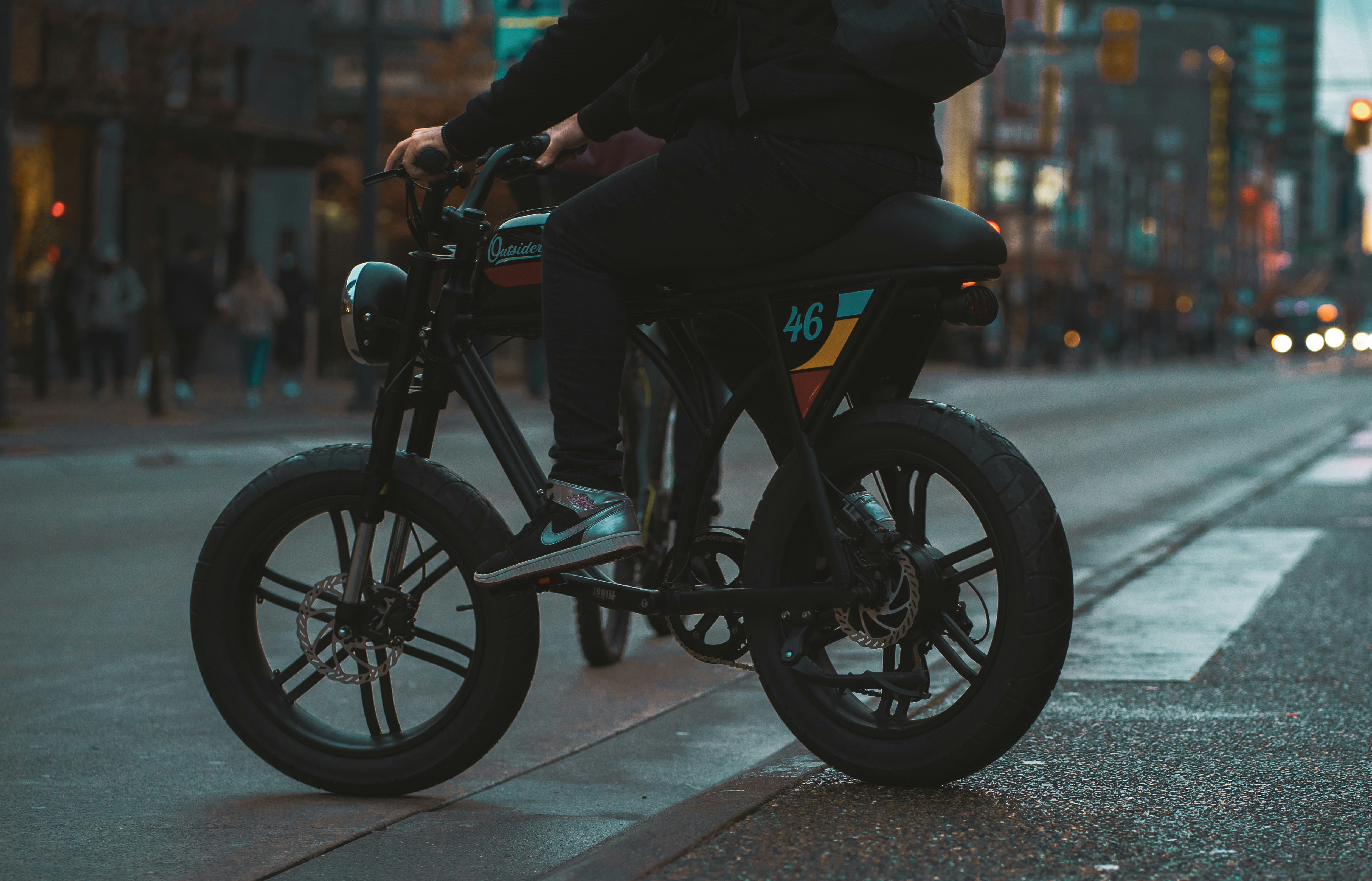 man in black jacket riding on black motorcycle