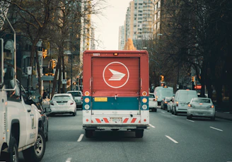 red and white bus on road during daytime