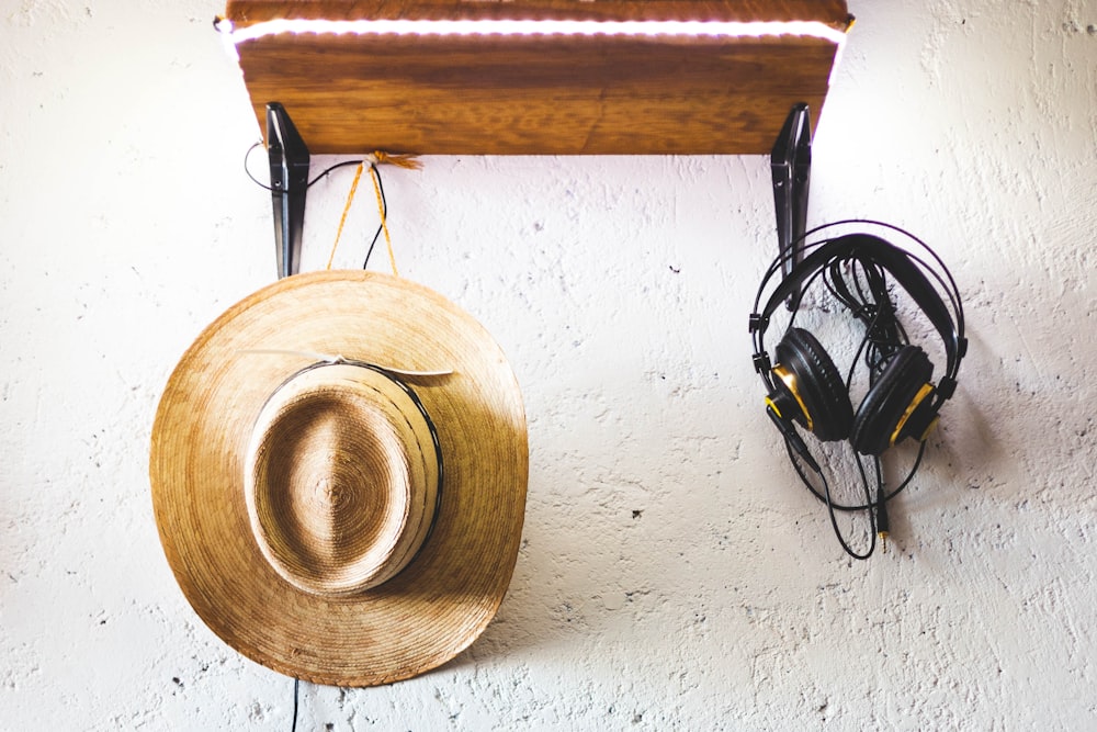 black headphones on brown wooden round table